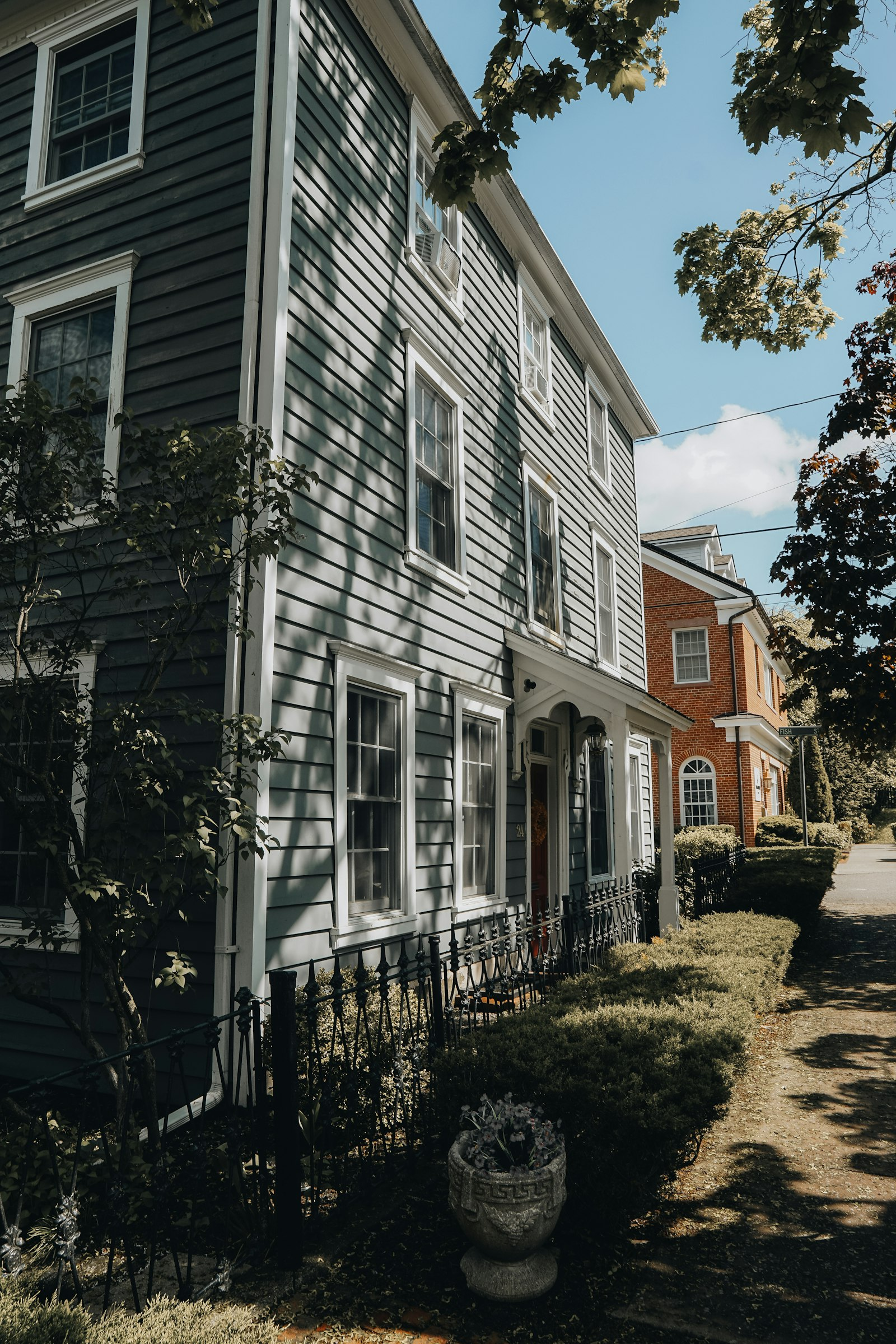 Historic two-story homes along a tree-lined street
